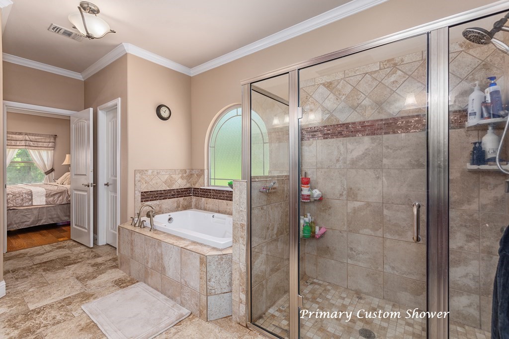 1171 Old Ewing Road Lufkin, TX 75901 - Photo 17 of 49 a bathroom with a tub shower vanity and a sink
