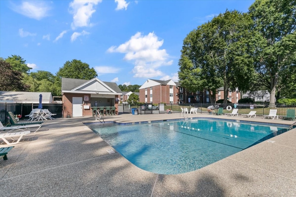 25 Clark's Road, Unit 101 Amesbury, MA 01913 - Photo 30 of 32 a view of swimming pool with outdoor seating and plants