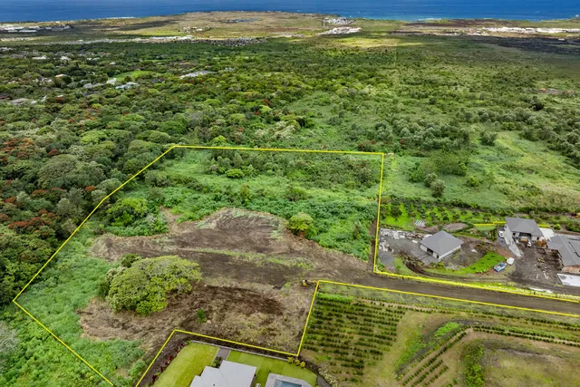 a view of a floor to ceiling window and an ocean view