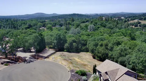 an aerial view of a house with mountain view