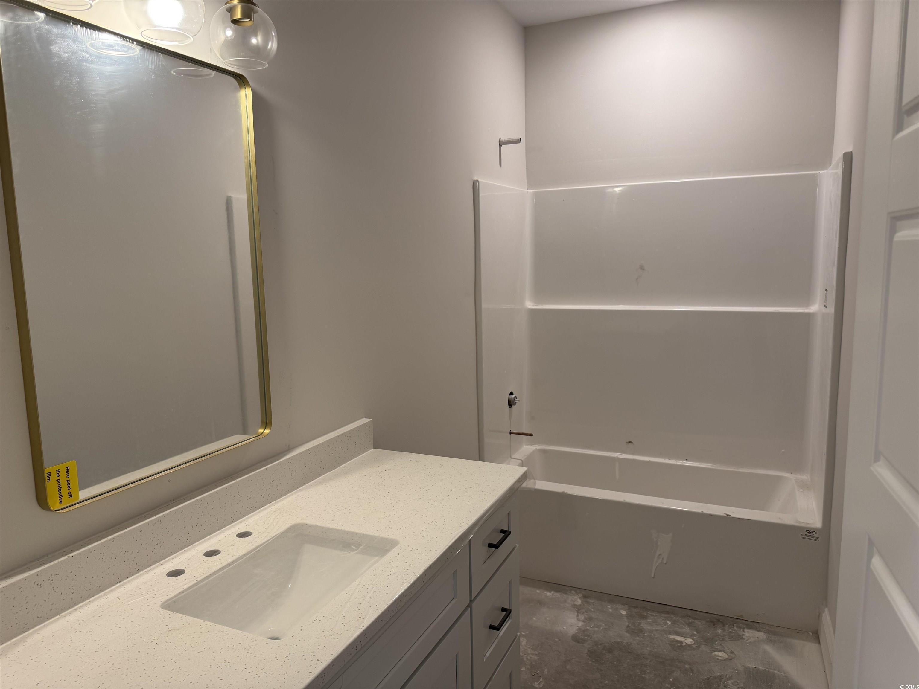 409 St John Road Galivants Ferry, SC 29544 - Photo 15 of 17 Bathroom featuring vanity and washtub / shower combination