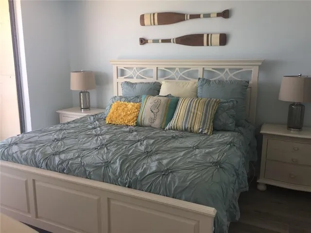 a bedroom with a bed and night stand