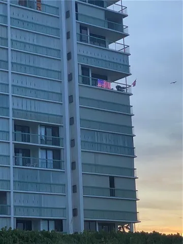 a bathroom with a granite countertop toilet sink and shower