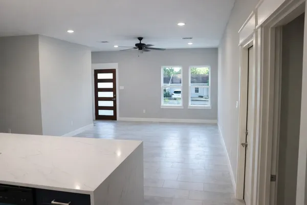 a view of a kitchen with wooden floor