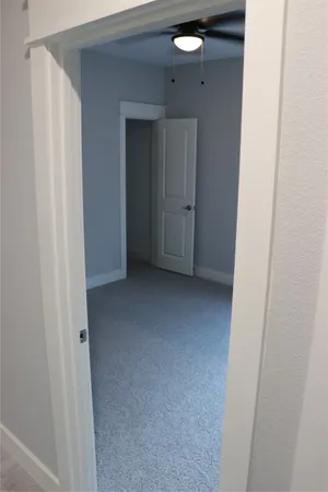 a view of hallway with closet