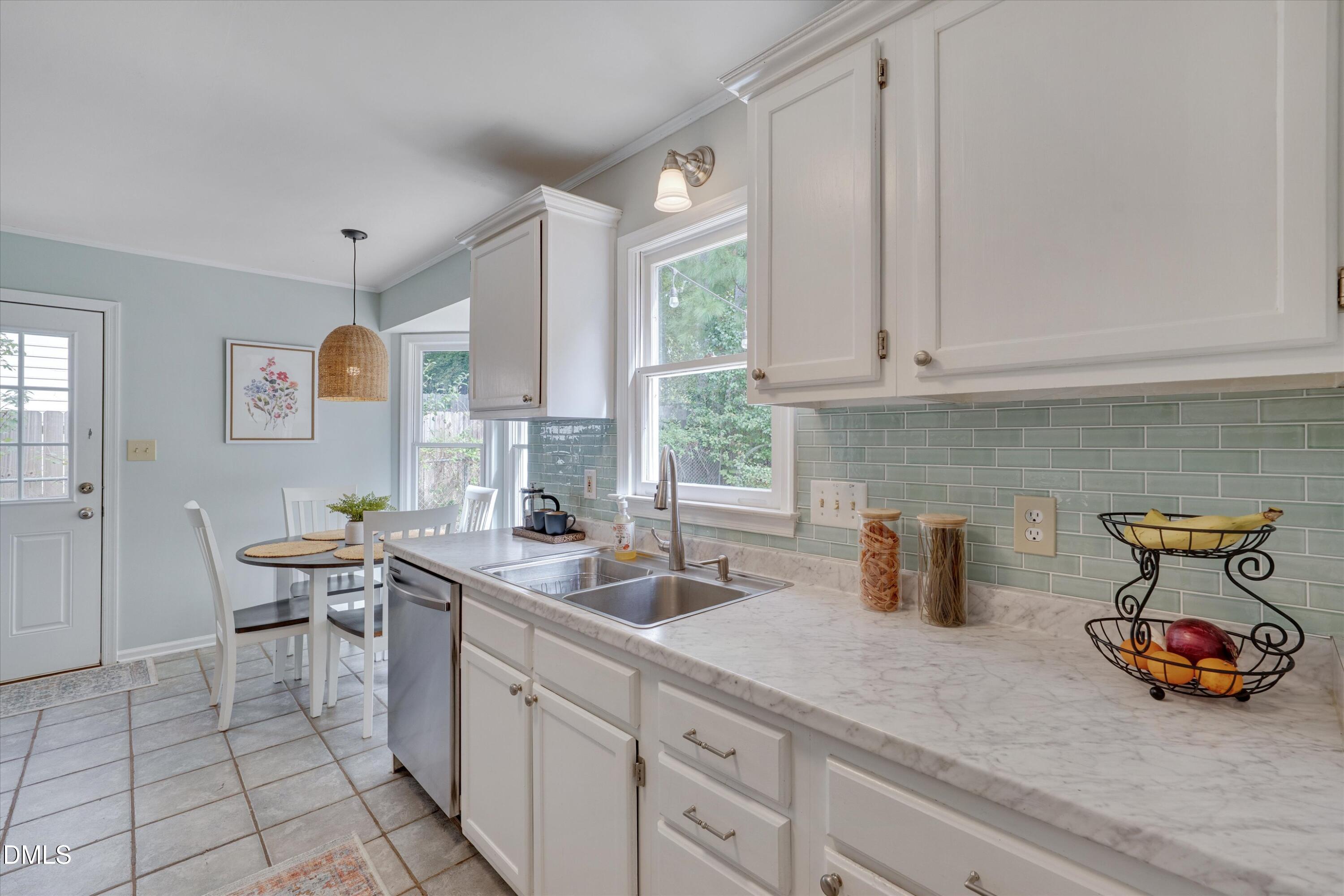 3301 Lassiter Street Durham, NC 27707 - Photo 13 of 32 a kitchen with a sink and cabinets