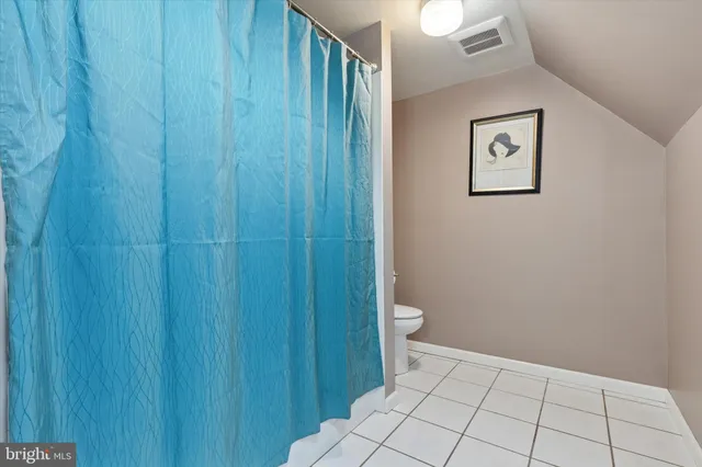 a spacious bathroom with a sink a mirror and a shower