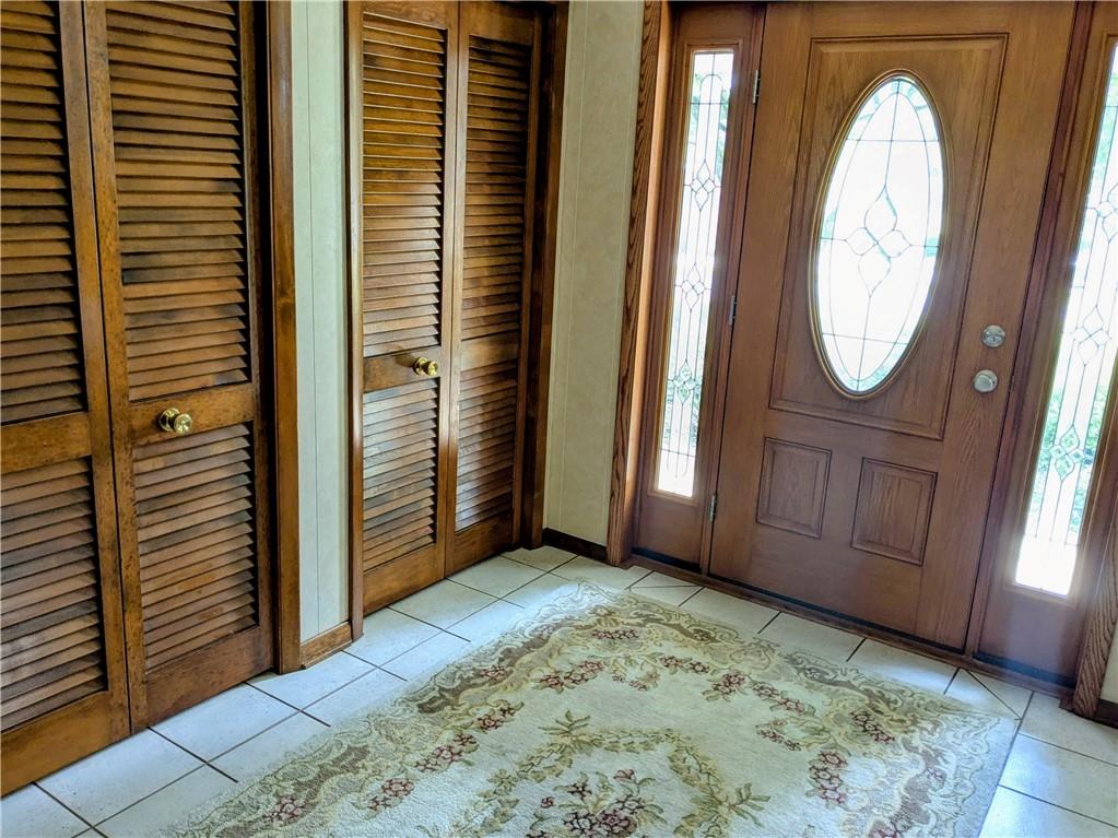 CERAMIC TILE AND DOUBLE CLOSETS. NEWER EXT DOOR WITH SIDE LIGHTS.