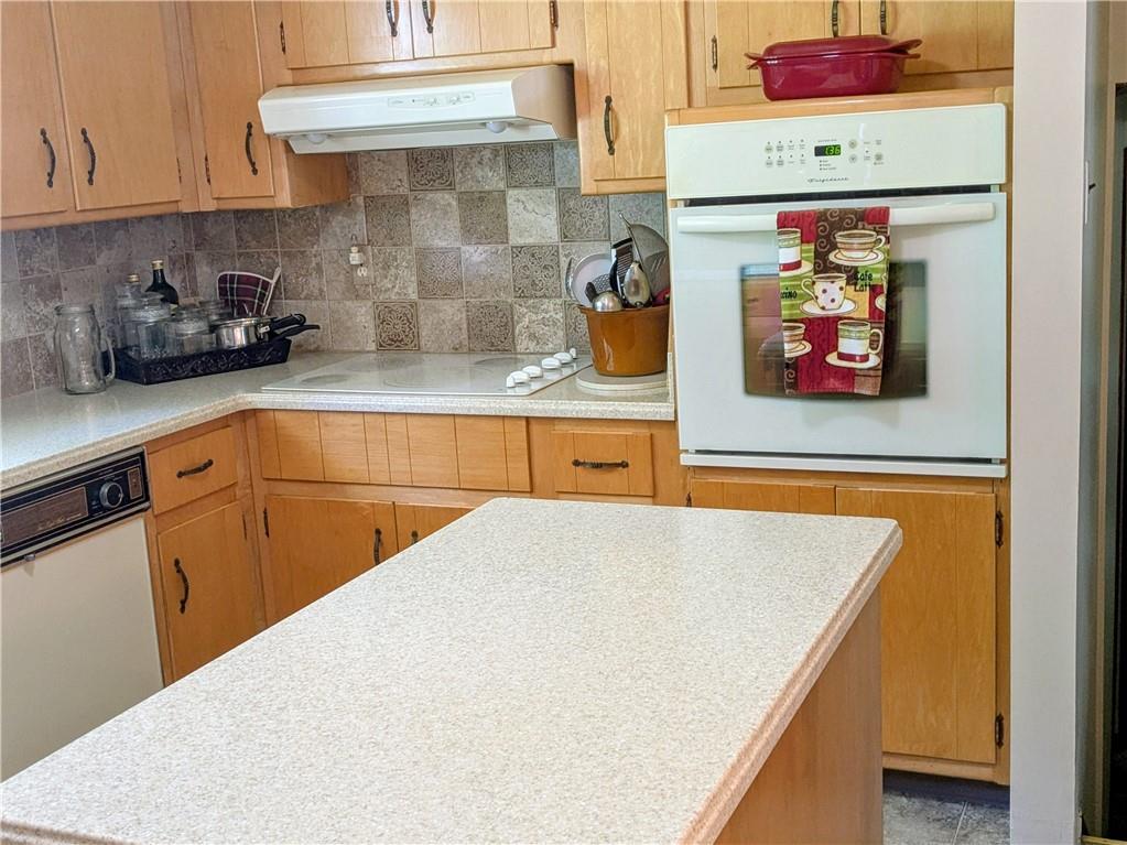 942 Shenango Road Beaver Falls, PA 15010 - Photo 8 of 38 CORIAN COUNTER TOPS WITH ISLAND.