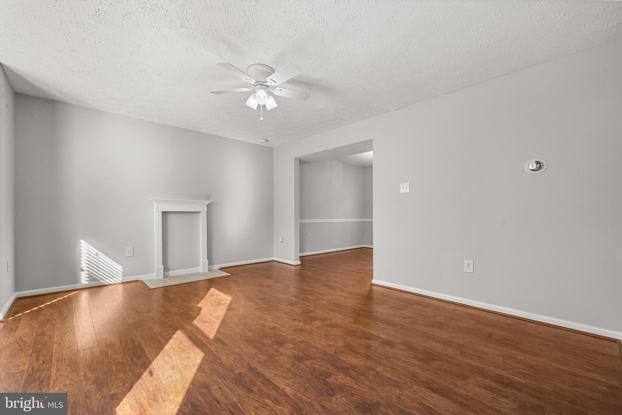 4001 Bittern Court Waldorf, MD 20603 - Photo 11 of 53 a view of a livingroom with a ceiling fan and wooden floor