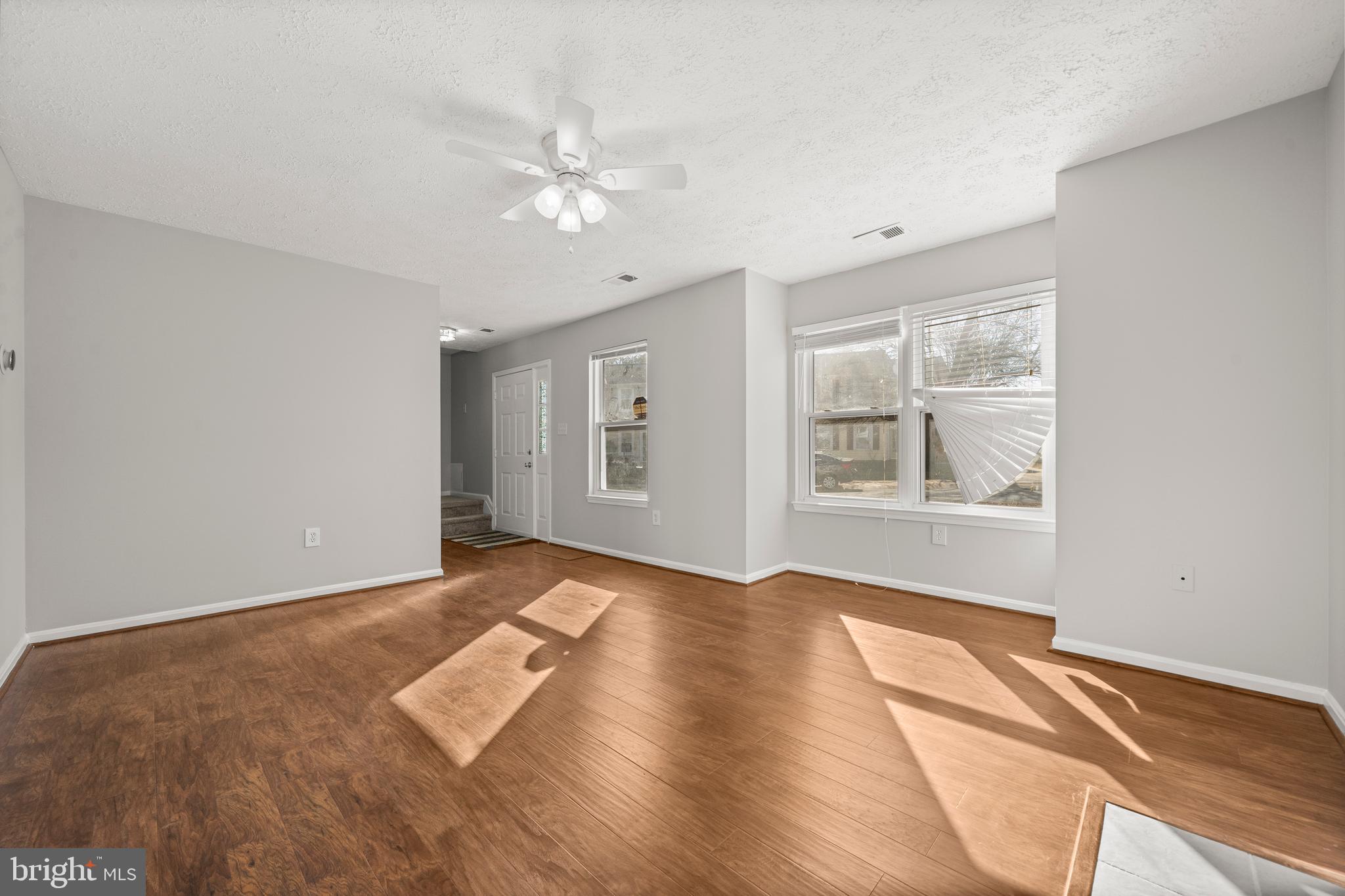 4001 Bittern Court Waldorf, MD 20603 - Photo 44 of 53 a view of an empty room with window and wooden floor