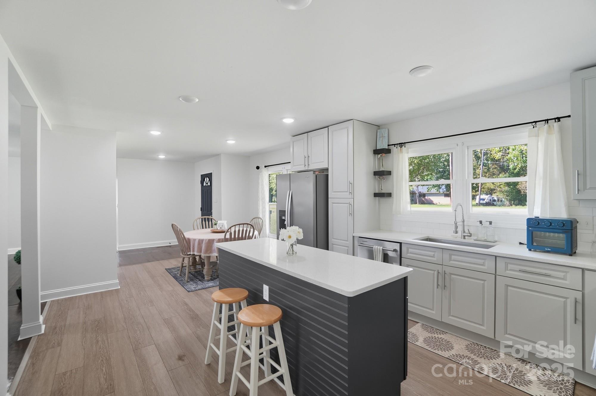 813 Bethlehem Road Kings Mountain, NC 28086 - Photo 12 of 39 a large kitchen with a table and chairs