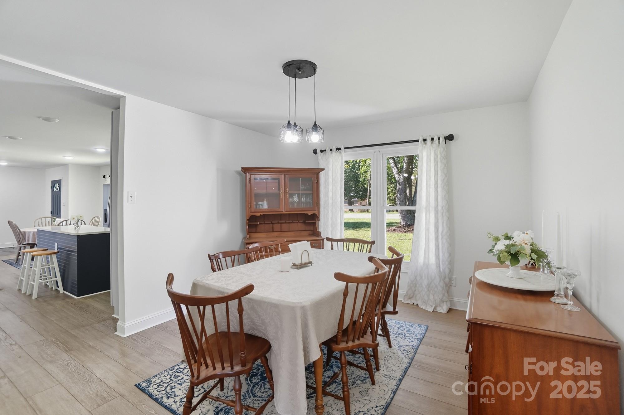 813 Bethlehem Road Kings Mountain, NC 28086 - Photo 15 of 39 a view of a dining room with furniture window and wooden floor