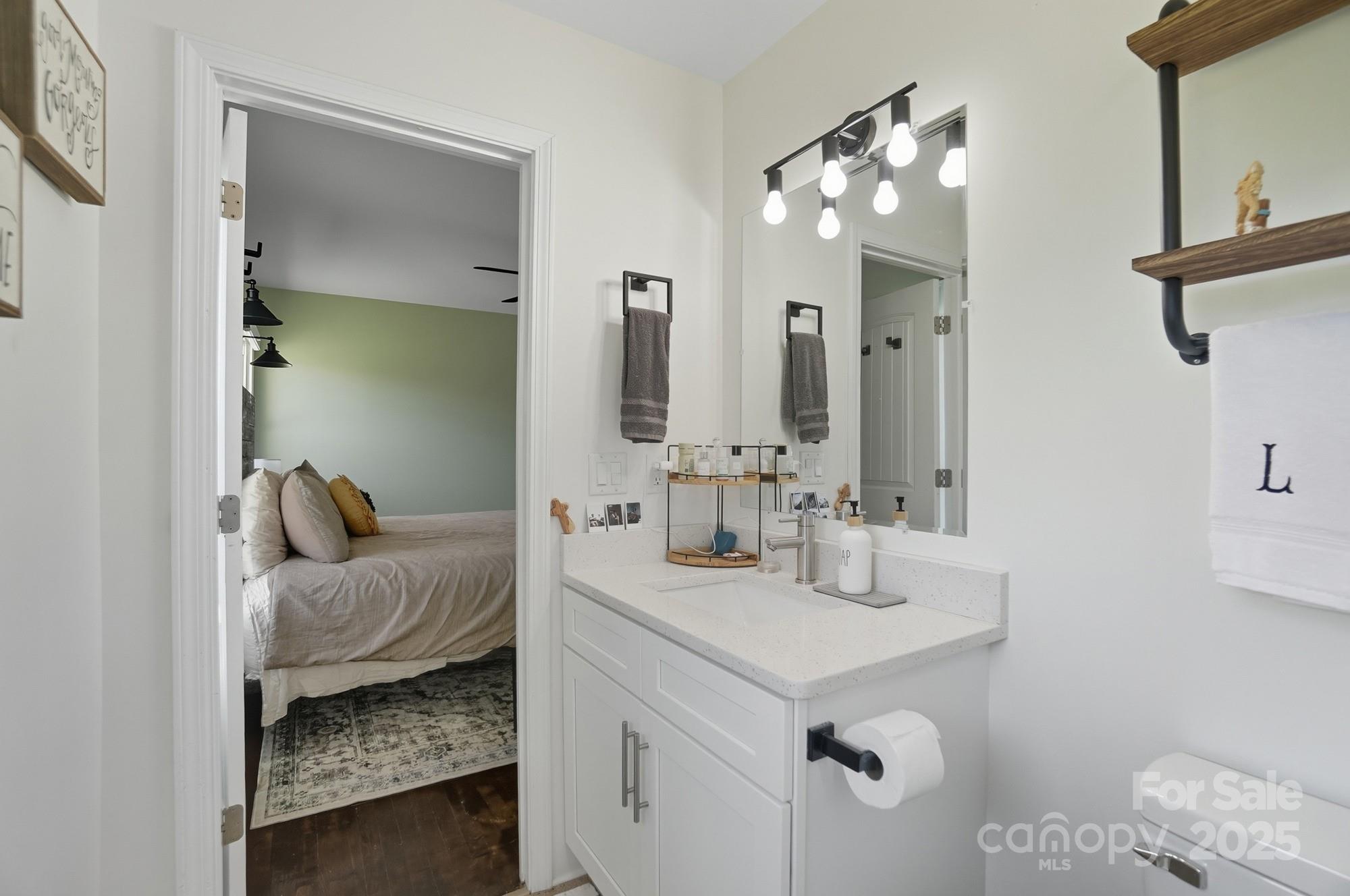 813 Bethlehem Road Kings Mountain, NC 28086 - Photo 23 of 39 a en suite bathroom with a granite countertop sink and a mirror