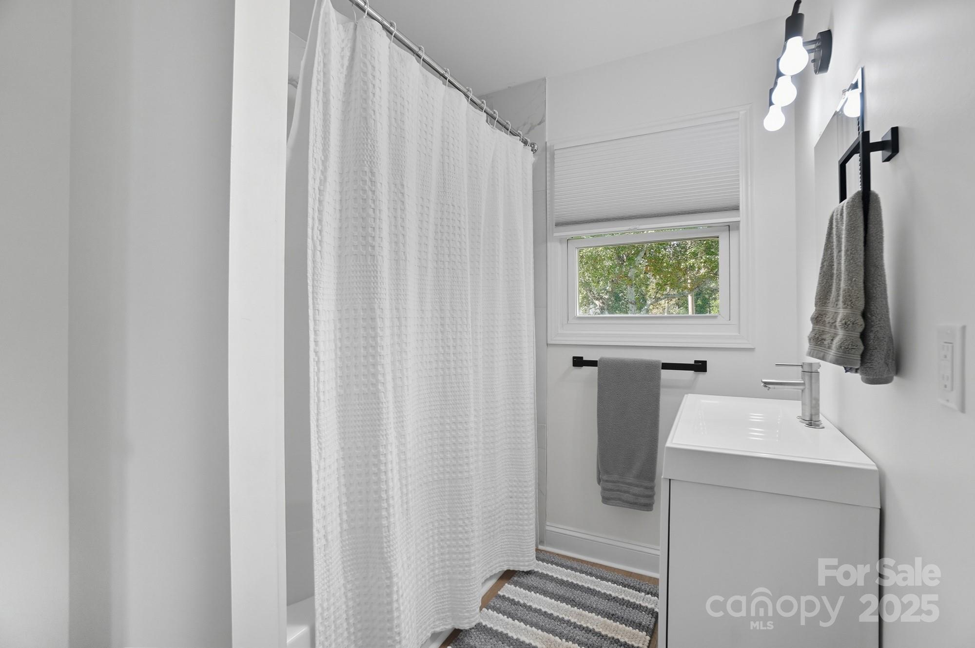 813 Bethlehem Road Kings Mountain, NC 28086 - Photo 27 of 39 a bathroom with a sink a mirror and shower