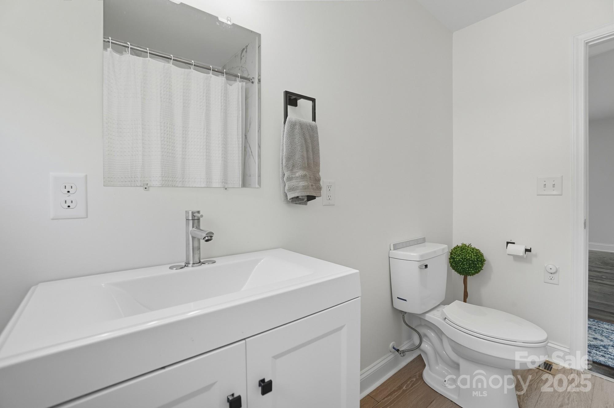 813 Bethlehem Road Kings Mountain, NC 28086 - Photo 28 of 39 a bathroom with a sink a toilet and a mirror