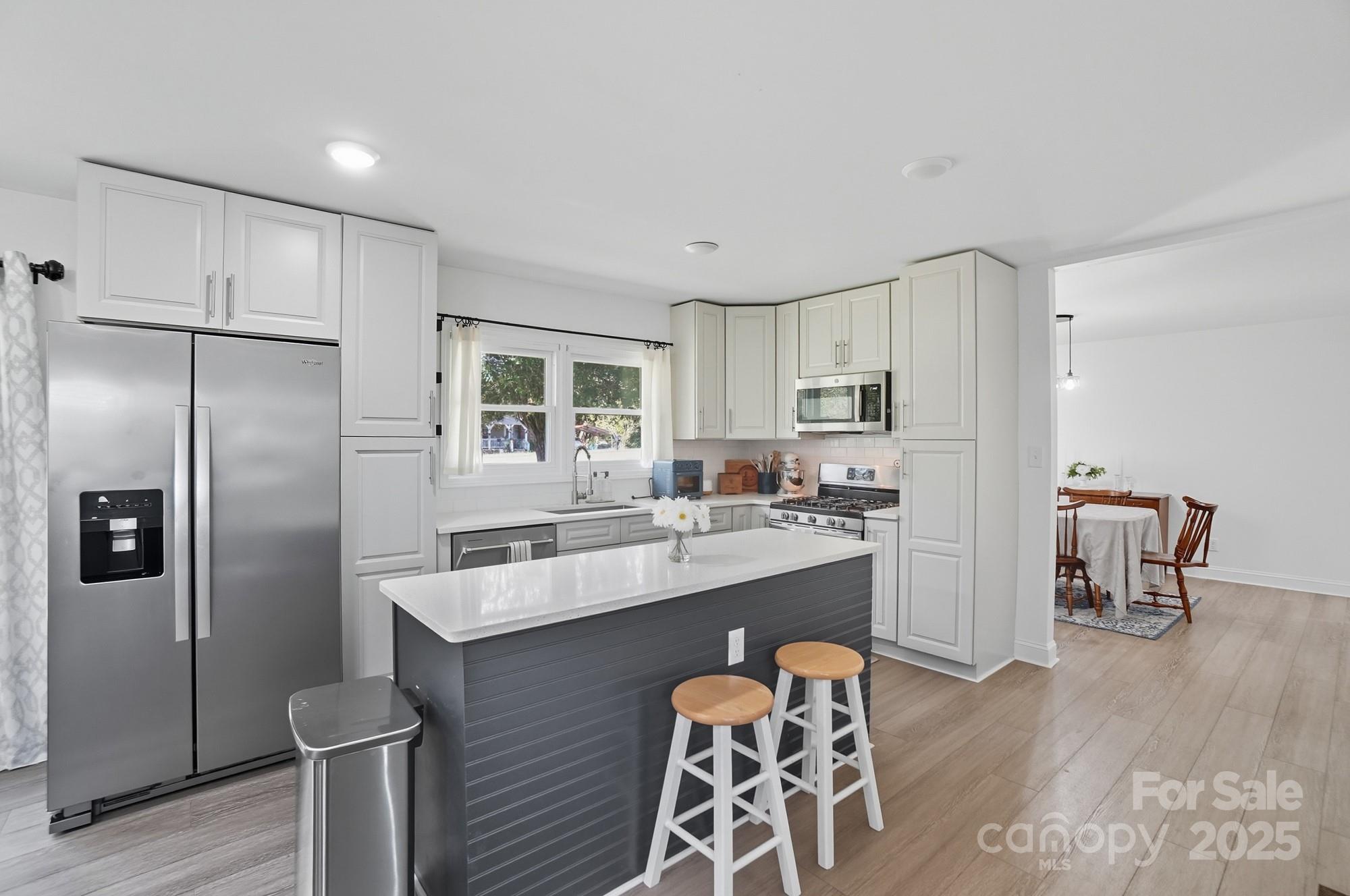 813 Bethlehem Road Kings Mountain, NC 28086 - Photo 5 of 39 a kitchen with stainless steel appliances granite countertop a refrigerator and a stove top oven