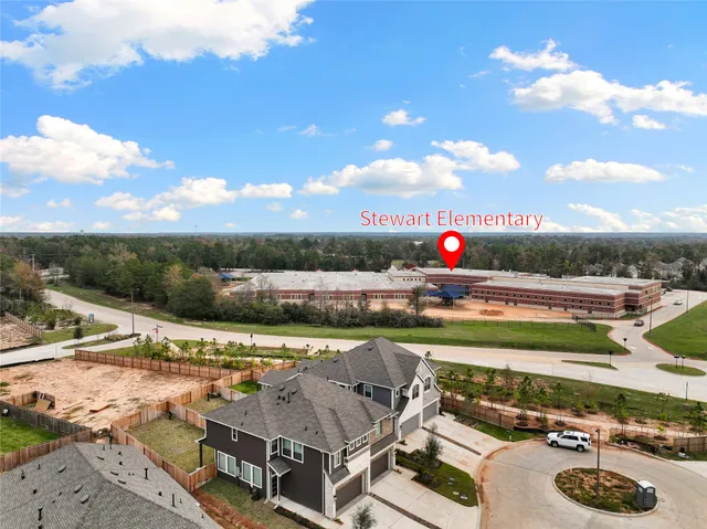 a view of a swimming pool with an outdoor seating