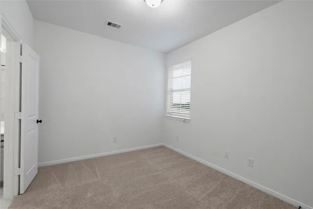 a view of empty room with windows