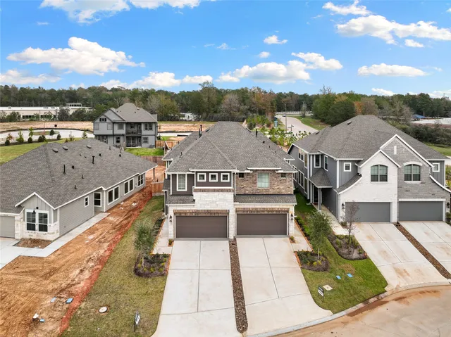 an aerial view of a house with a ocean view