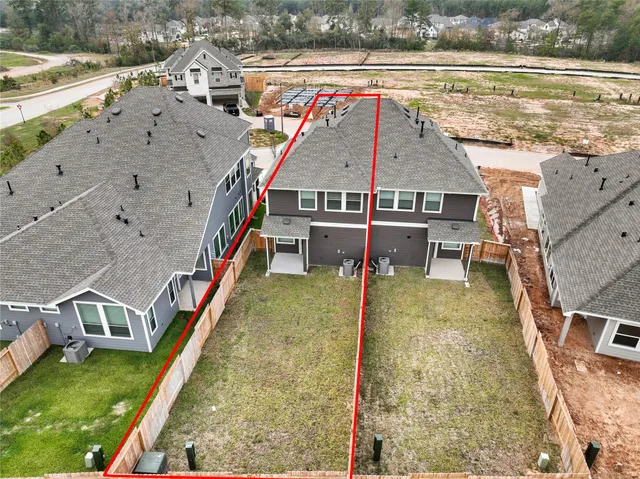 an aerial view of a house with a ocean view