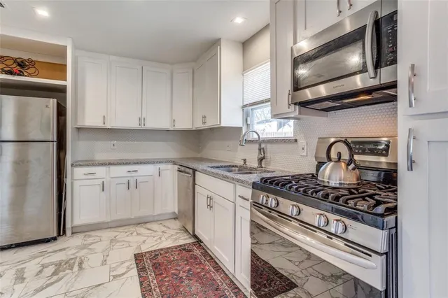 a kitchen with a stove and a microwave