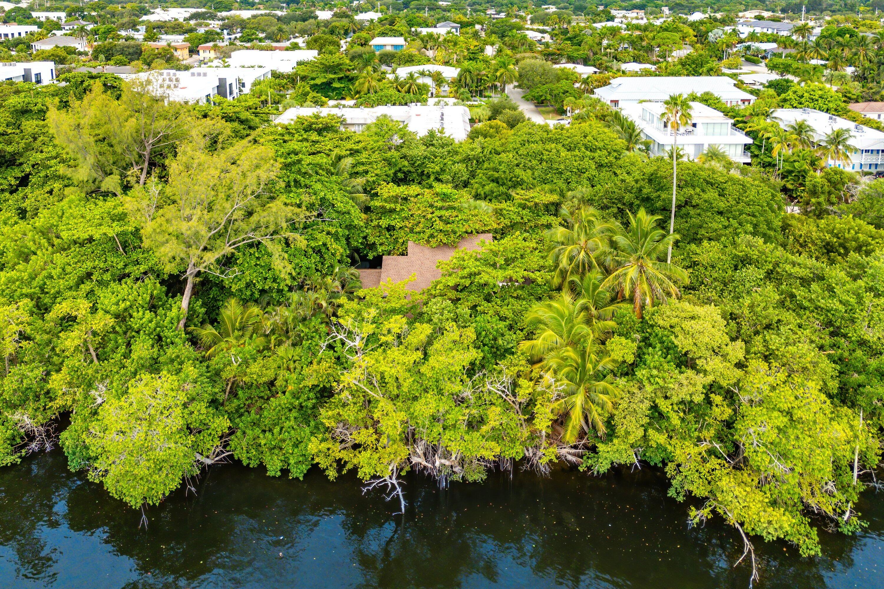 1001 Palm Trail Delray Beach, FL 33483 - Photo 4 of 5 a view of a lake from a yard
