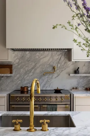 a kitchen with a table chairs and a refrigerator