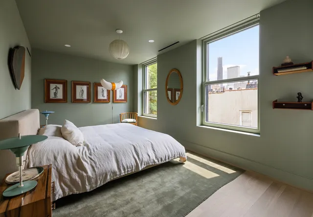 a bedroom with bed and a window