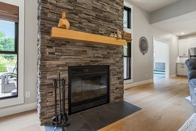 a large kitchen with stainless steel appliances granite countertop a stove and a sink