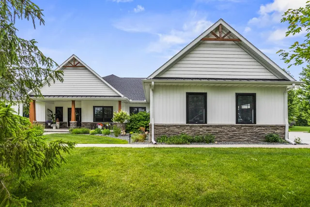 a front view of house with yard and green space