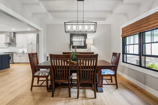 a bathroom with a granite countertop sink and a toilet