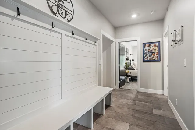 a kitchen with stainless steel appliances granite countertop a sink and a wooden cabinets