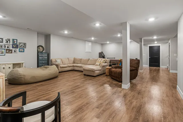 a view of a chair and table on the green field