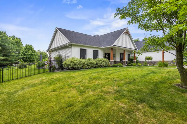 a view of a patio with couches table and chairs and potted plants