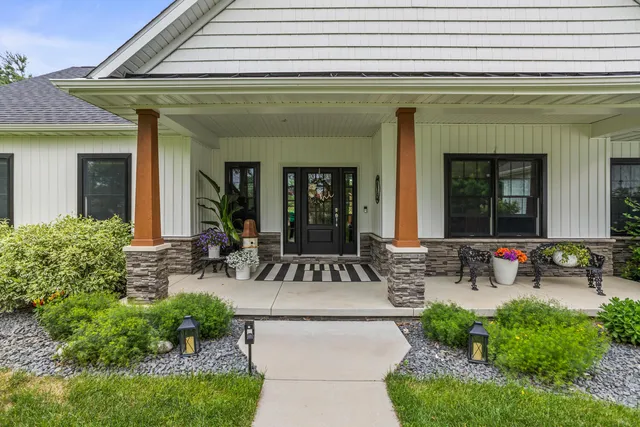 a living room with furniture and flowers