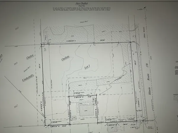 a view of a swimming pool and an outdoor seating