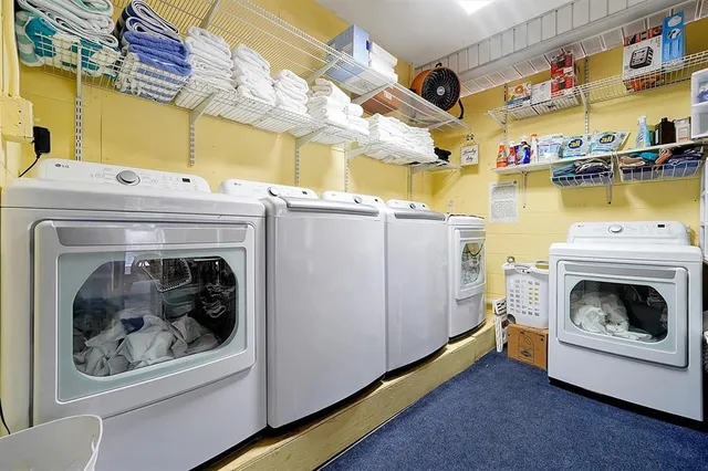 a view of a patio with a table and chairs