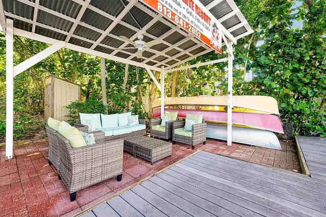 a view of a dining room with furniture and a window