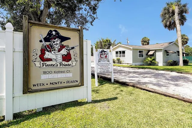 front view of a house with a trees
