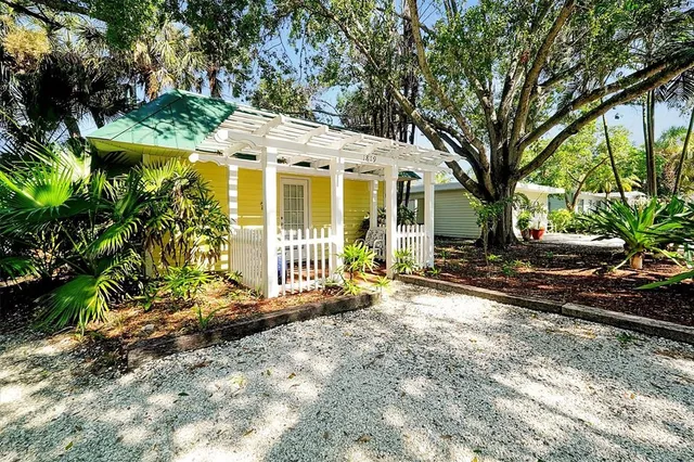 a kitchen with cabinets and window