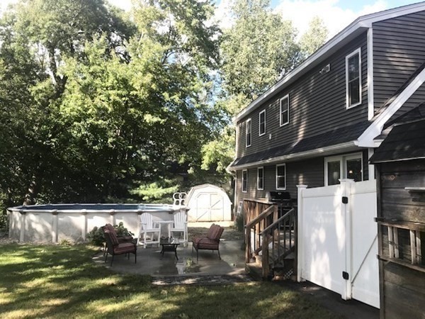 11 Woodbury Road Billerica, MA 01821 - Photo 25 of 27 a view of a house with a yard