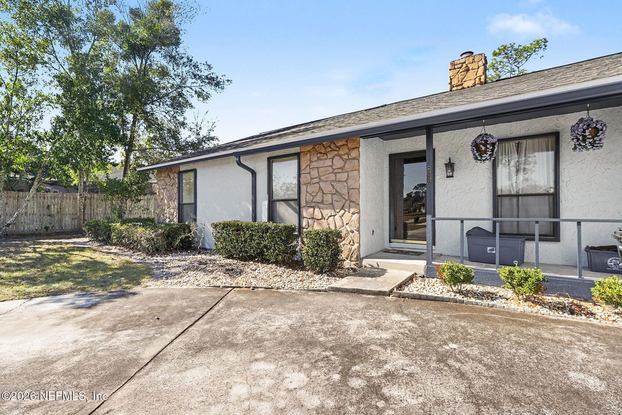 2551 Ridgecrest Avenue Orange Park, FL 32065 - Photo 2 of 28 a view of a house with backyard and sitting area