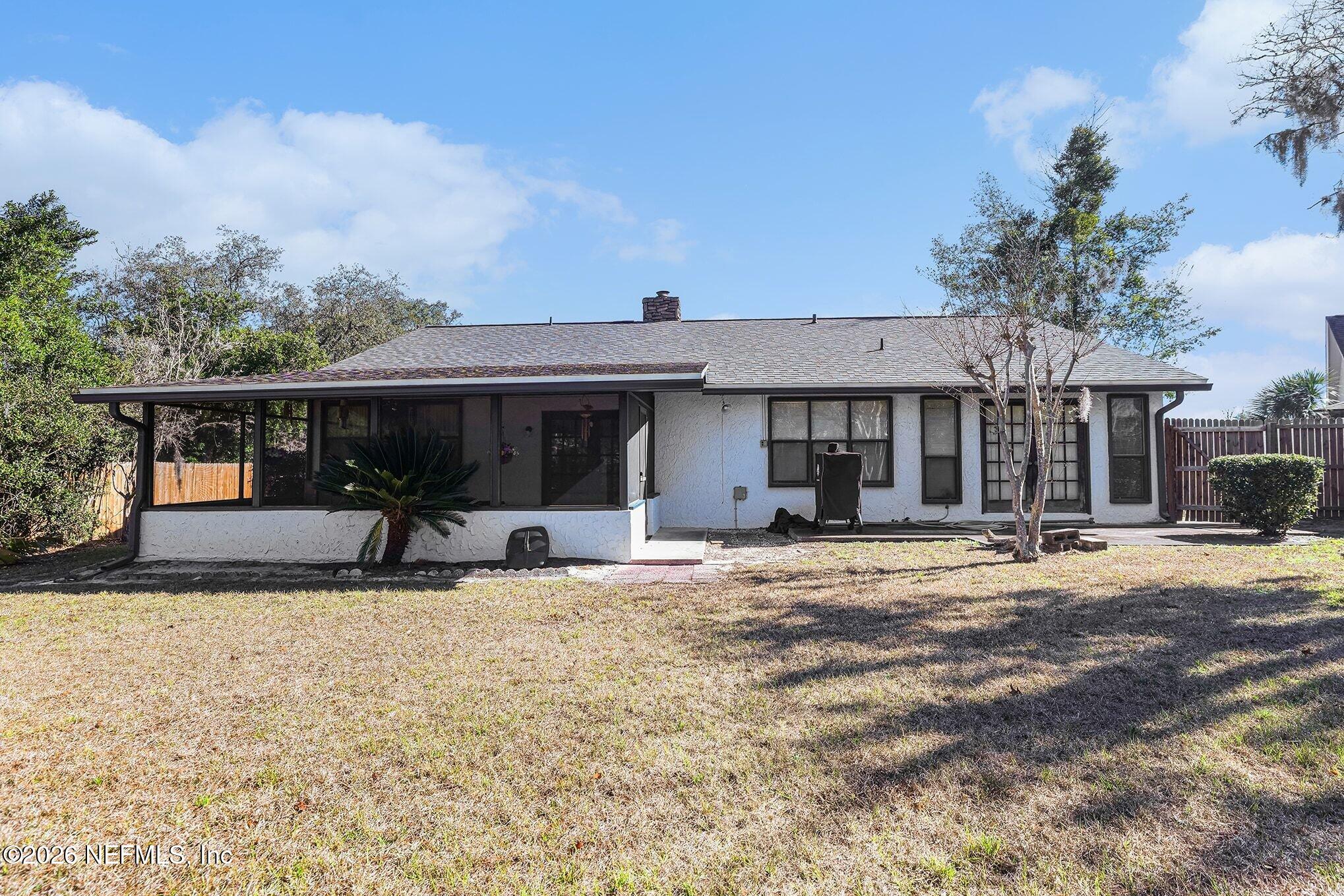 2551 Ridgecrest Avenue Orange Park, FL 32065 - Photo 22 of 28 a front view of a house with a yard patio and dinning area