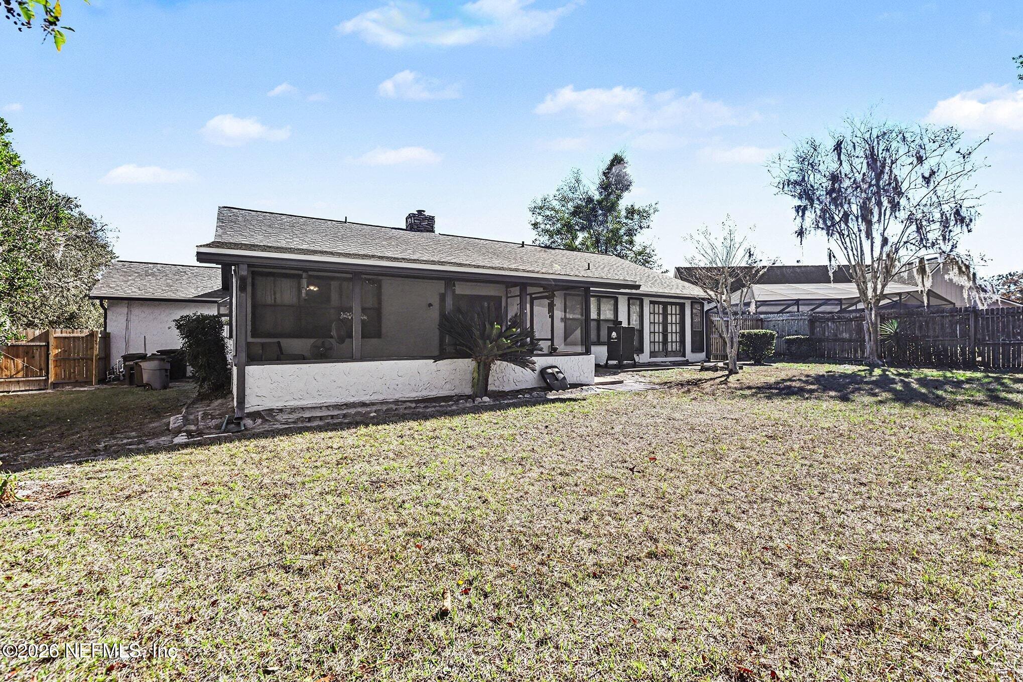 2551 Ridgecrest Avenue Orange Park, FL 32065 - Photo 23 of 28 a view of a house with backyard and porch