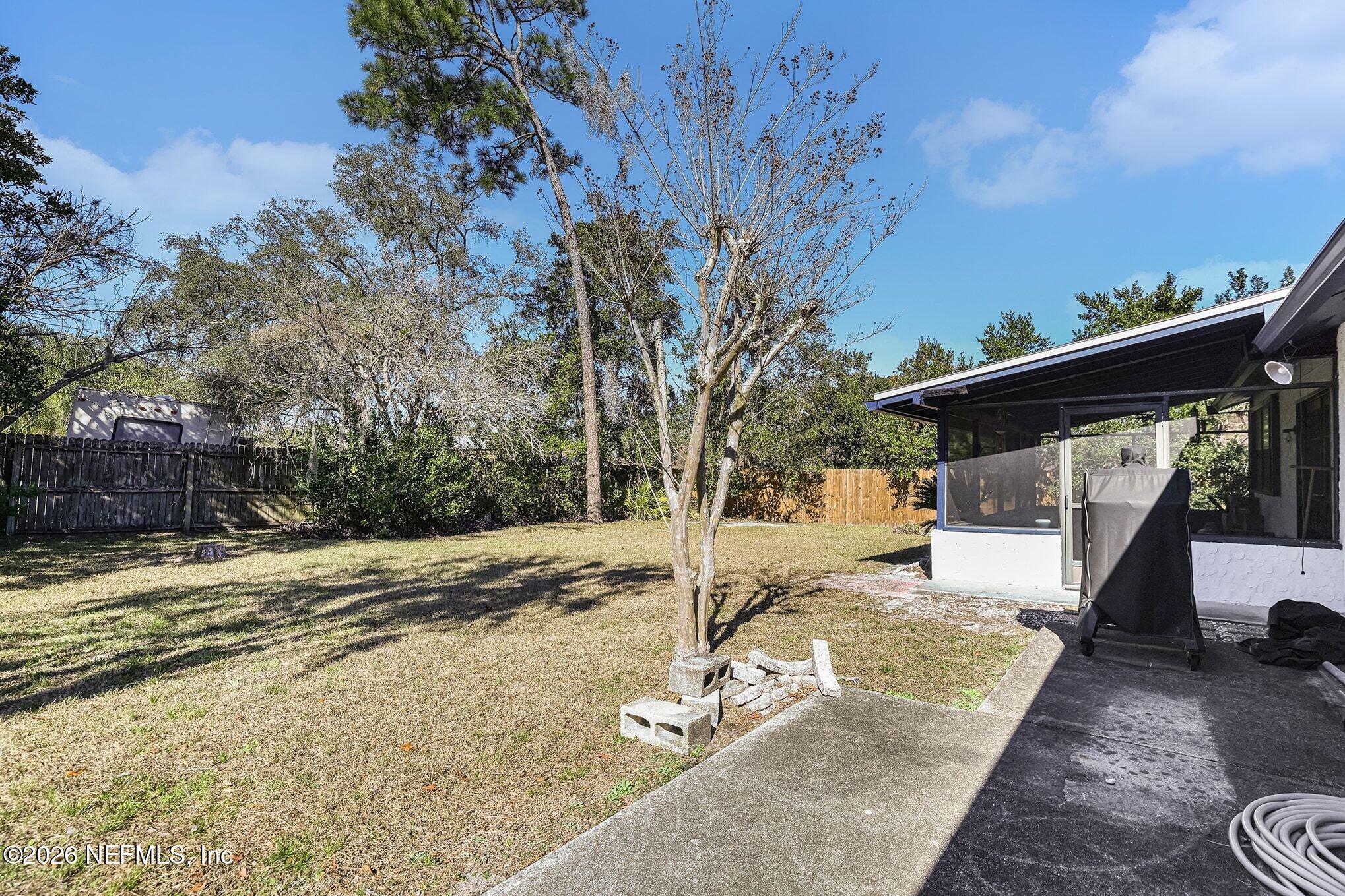 2551 Ridgecrest Avenue Orange Park, FL 32065 - Photo 25 of 28 a backyard of a house with table and chairs