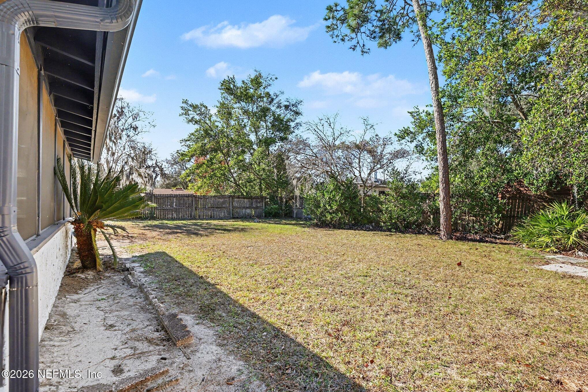 2551 Ridgecrest Avenue Orange Park, FL 32065 - Photo 26 of 28 a view of a yard with trees