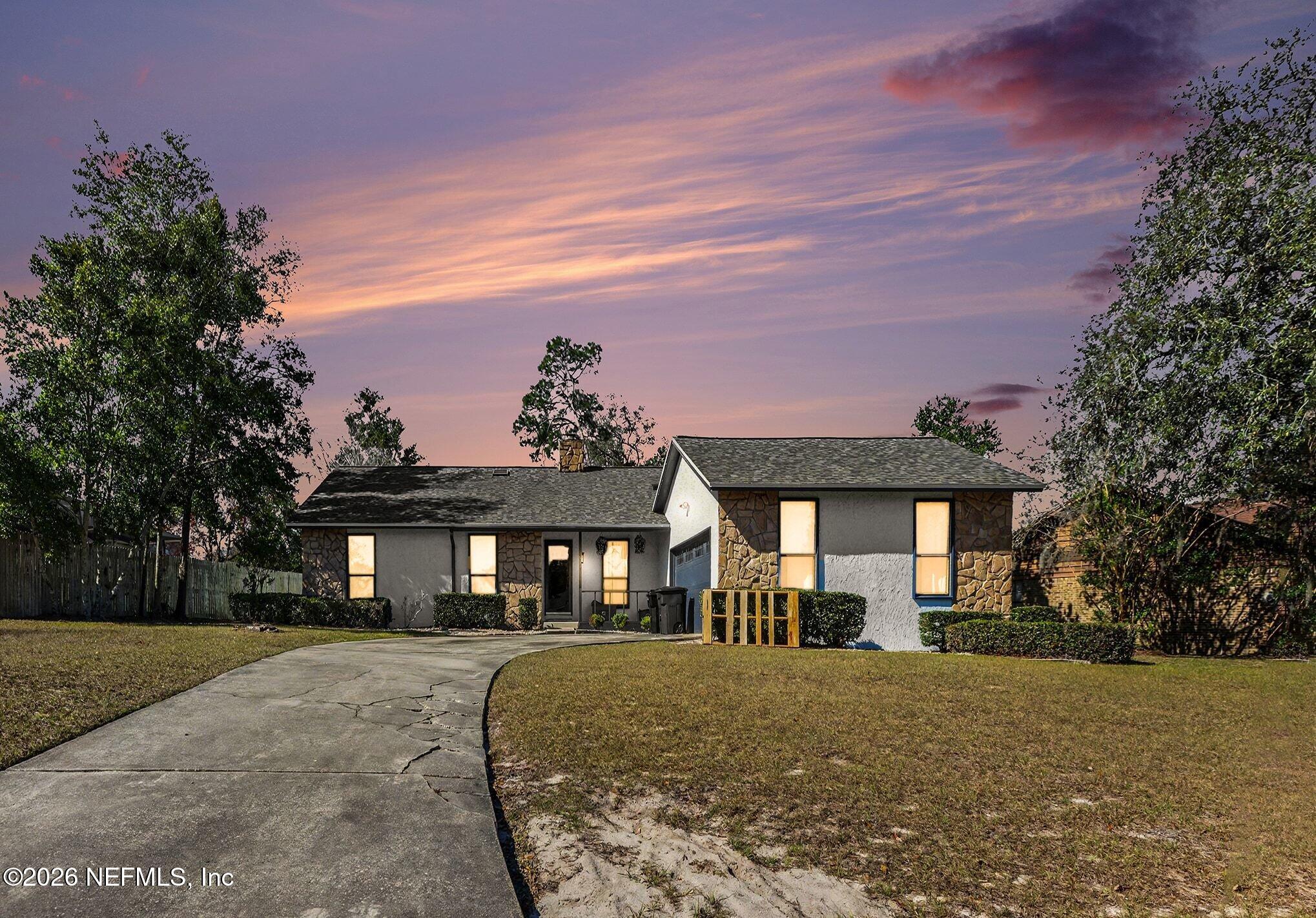 2551 Ridgecrest Avenue Orange Park, FL 32065 - Photo 27 of 28 a front view of a house with a yard