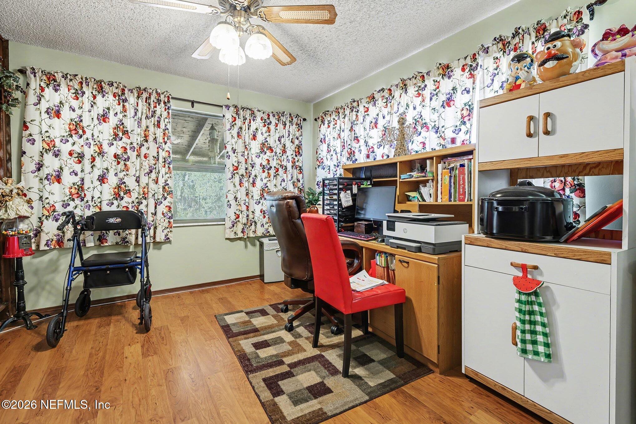 2551 Ridgecrest Avenue Orange Park, FL 32065 - Photo 6 of 28 a dining room with furniture and a chandelier