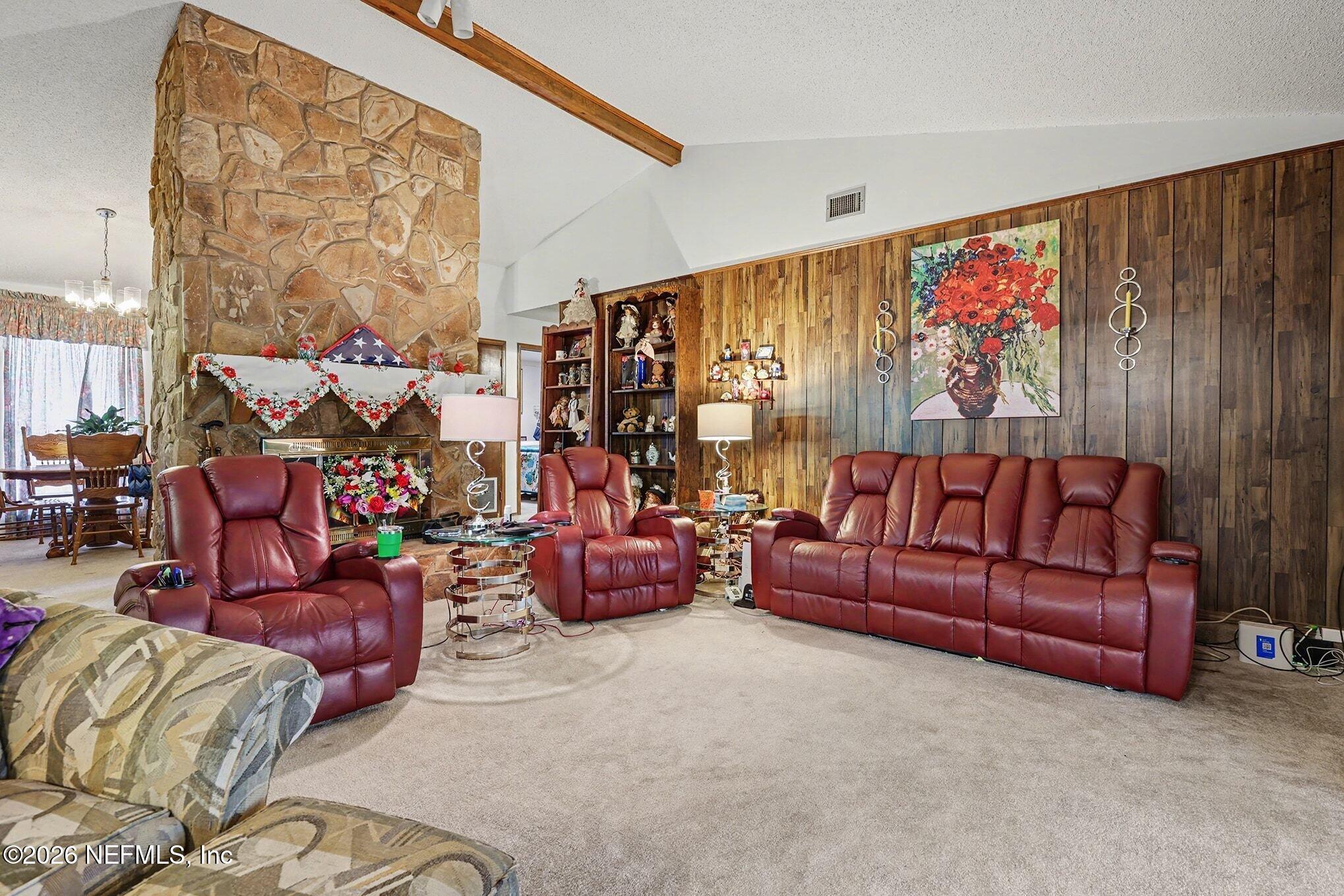 2551 Ridgecrest Avenue Orange Park, FL 32065 - Photo 7 of 28 a living room with furniture a couch and a large window